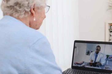 Woman meeting virtually with Doctor